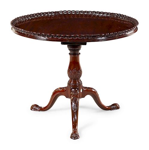 A Chippendale Style Carved, Pierced and Figured Mahogany Tilt-Top Tea Table