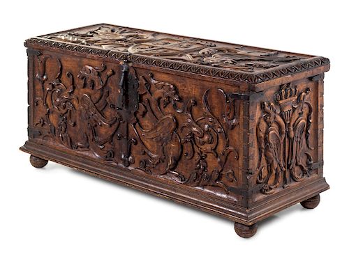 A Continental Carved Walnut Cassone