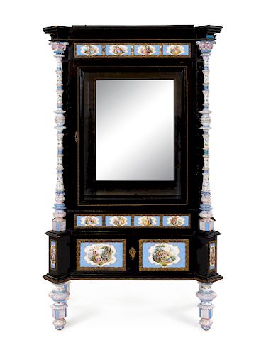 A Meissen Porcelain Mounted Ebonized Vitrine Cabinet