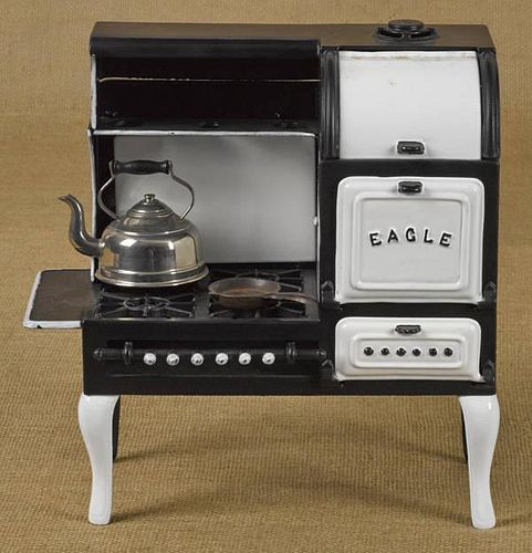 Hubley cast iron Eagle toy gas stove with a tea