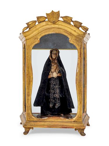 A Continental Giltwood Reliquary with a Painted Figure of a Saint