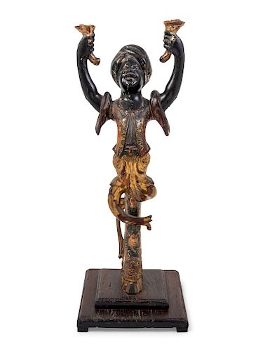 A Venetian Painted Figural Stand
Height 28 inches.