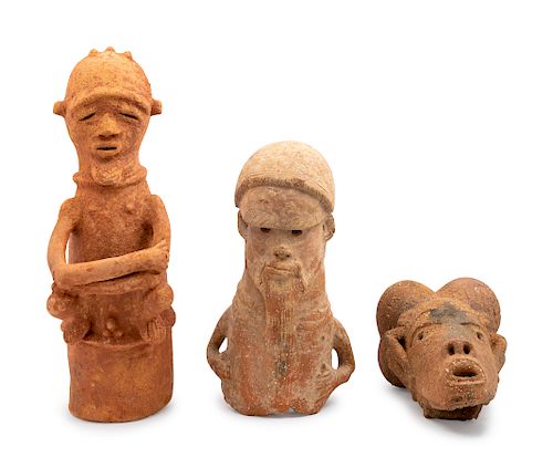 Two Earthenware Figures and a Nok Earthenware Head
Height of tallest 25 inches.