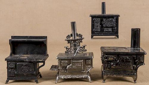Four cast iron and nickel toys stoves, to include