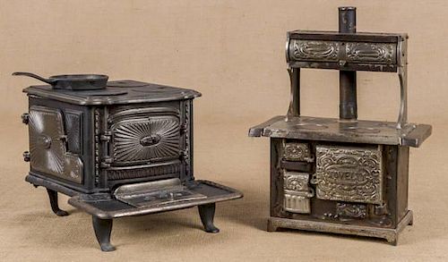 Two cast iron toy stoves, to include one Kenton