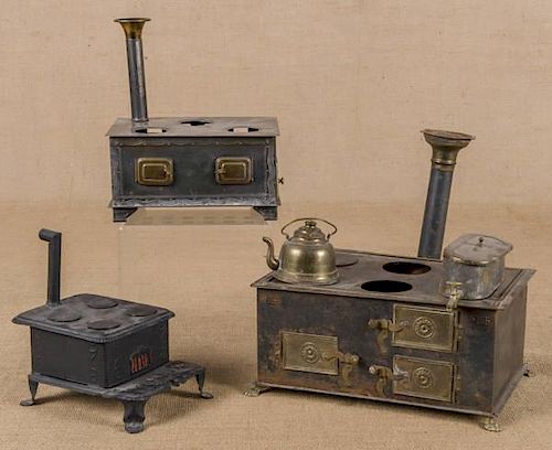 Three tin toy stoves, to include a Phoenix, 4 1