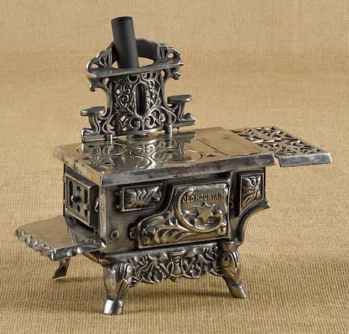 Cast iron and nickel Cold Mountain toy stove, 1