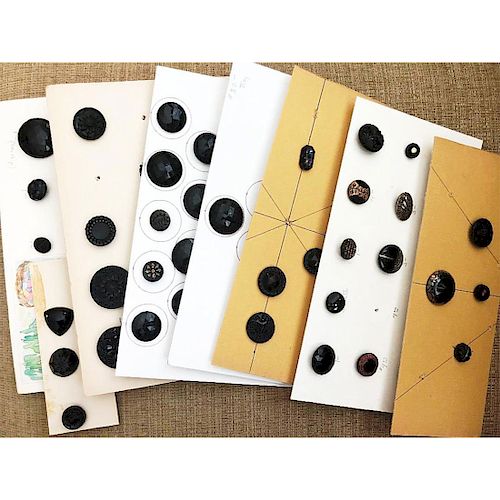 7 SMALL CARDS OF ASSORTED BLACK GLASS BUTTONS