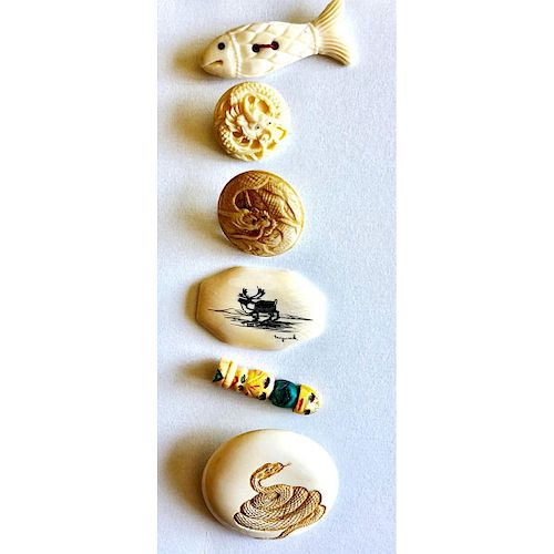 A GROUPING OF NATURAL MATERIAL BUTTONS