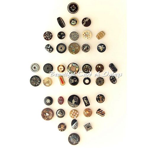 A FULL CARD OF HORN AND NATURAL MATERIAL INLAY BUTTONS