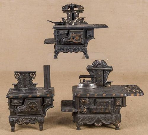 Three cast iron toy stoves, to include a Grey Iro