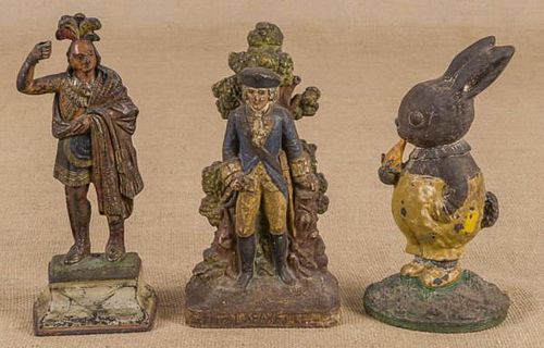 Three cast iron doorstops, to include George Wash