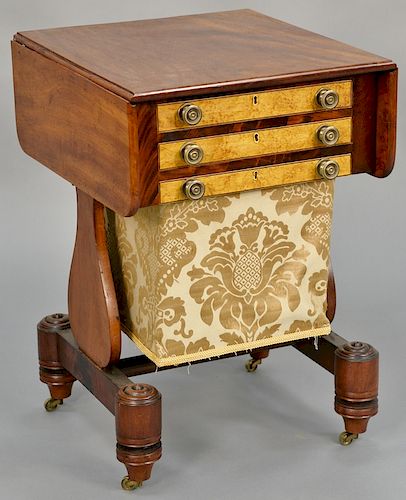 Empire mahogany stand, having drop leaves and three figured maple drawer fronts, including one bag drawer, circa 1830. height 27 inches, top: 20" x 32