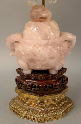 Large rose quartz covered incense urn, having dragon head and loop handles, on three ogre mask feet, carved dragons amid clouds and pierced dome cover