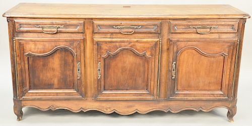 Louis XV sideboard, having three drawers over three doors set on cabriole legs, 18th century. height 38 inches, width 28 inches, depth 21 inches.
