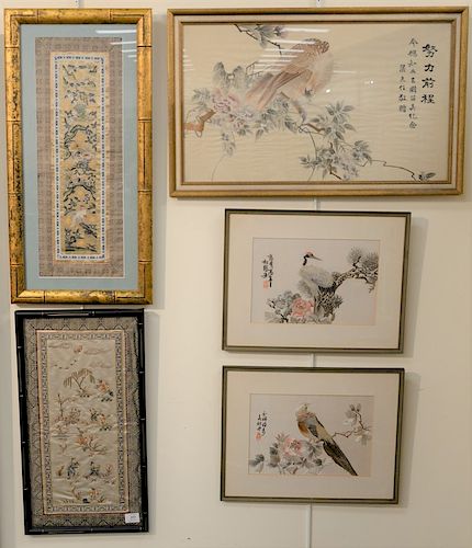 Group of five framed Chinese silk embroidery panels with embroidered figures, pair of embroidered bird panels, panel with foo lions and birds and larg