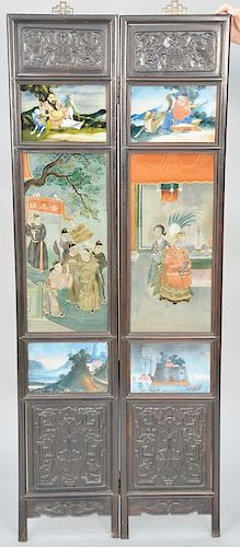 Chinese two panel folding screen, each panel having hardwood frame, two carved panels and three reverse paintings on glass, panels depicting figures a