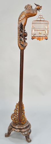 Chinese carved floor lamp stand, carved form peacock holding a birdcage. height 74 inches.