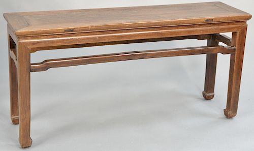 Hardwood bench, China, 19th/20th century, of classic Ming style with unadorned open apron and legs ending in simple hoof feet, top: 11" x 41". height: