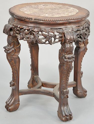 Marble inlaid circular taboret, China 19th century, with ornately carved apron and zoomorphic legs ending in ball and claw feet, the top inlaid with o