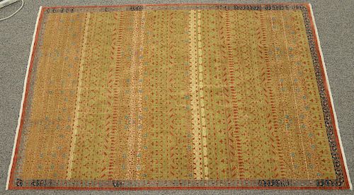 Egyptian wool carpet with honey beige ground, red and blue design. 6' x 9'. Provenance: Estate of Mark W. Izard MD, Cider Brook Road, Avon, CT
