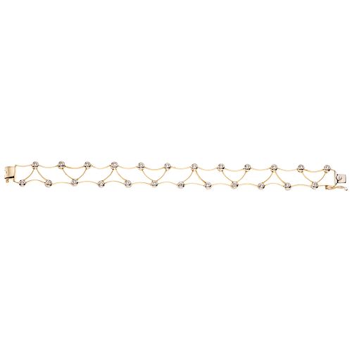 A yellow gold 14 K bracelet with simulants.