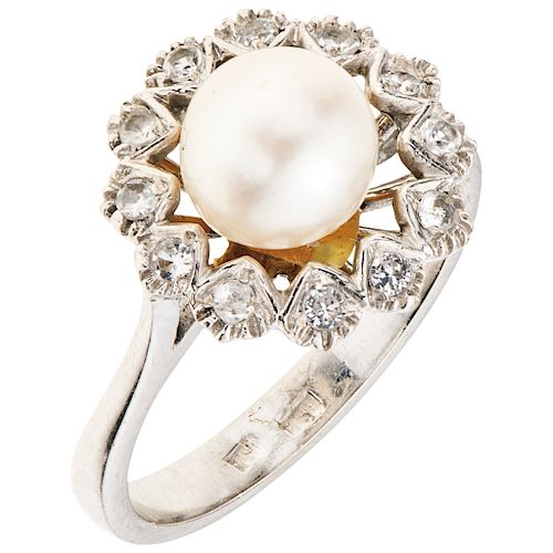 A white gold 18 K ring with cultured pearl and simulants.