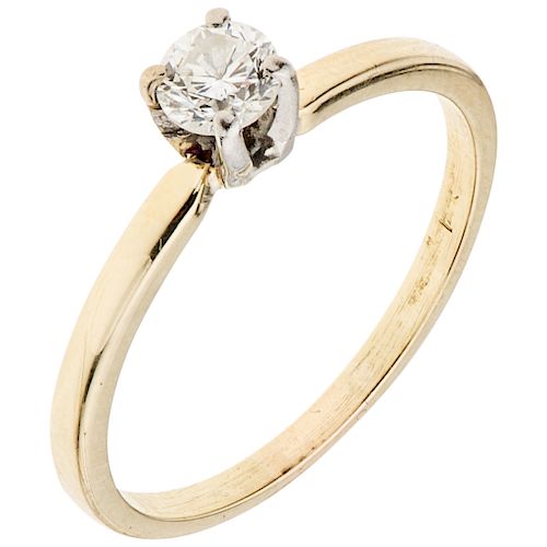 A  yellow gold 14K solitaire ring with diamond.