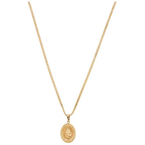 A yellow gold 18 K necklace and medal.