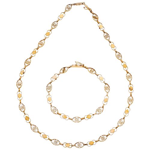 A yellow gold 14 K filigree necklace and bracelet set.