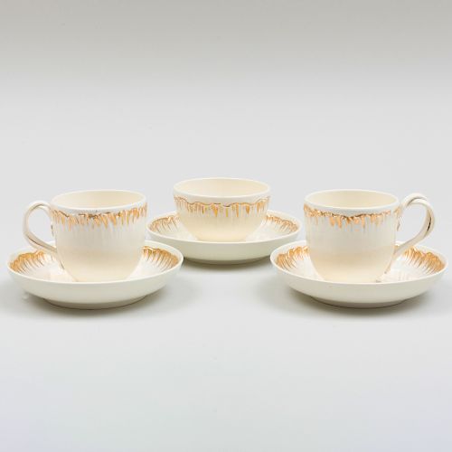 Pair of Wedgwood Gilt-Decorated Creamware Cups and Saucers and a Teabowl and Saucer