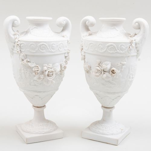 Pair of Continental Biscuit Porcelain Urns