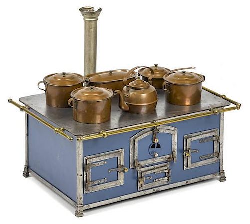 Cast iron, nickel, and brass toy stove with origi