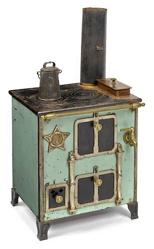 Cast iron, nickel, copper, and enameled toy stove