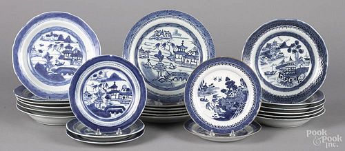 Twenty-three Chinese export blue and white plates and soup bowls, 19th c., 7 1/2'' - 9 1/2'' dia.