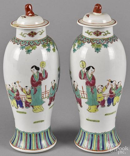Pair of Chinese porcelain garniture vases and covers, mid 20th c., 12'' h.