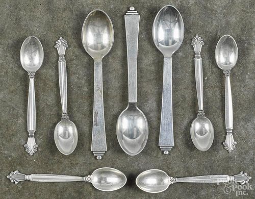 Nine George Jensen sterling silver spoons, six - 3 3/4'' l., three - 4 3/4'' l., 3.9 ozt.