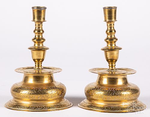 Pair of engraved brass candlesticks