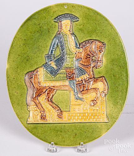 Pottery plaque of a colonial horse and rider
