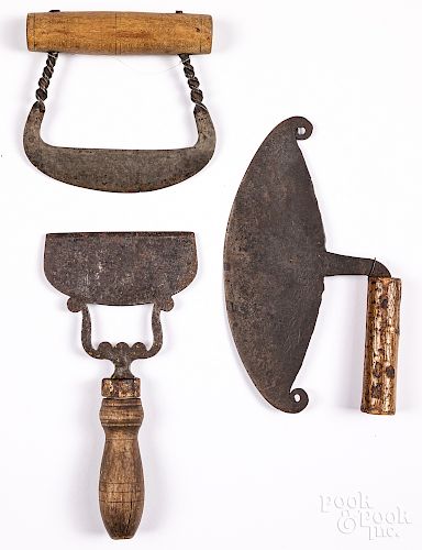 Three wrought iron food choppers