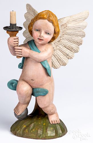 Carved and painted cherub candleholder