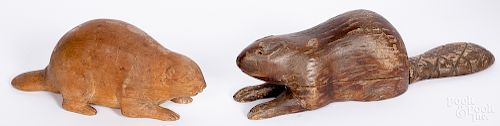 Two carved pine beavers