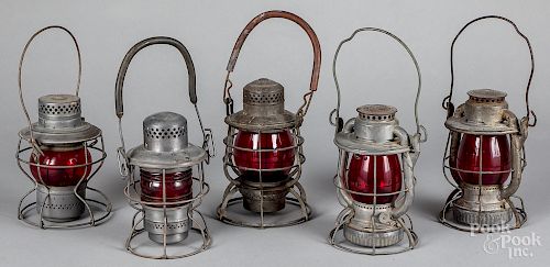 Five red globe railroad lanterns