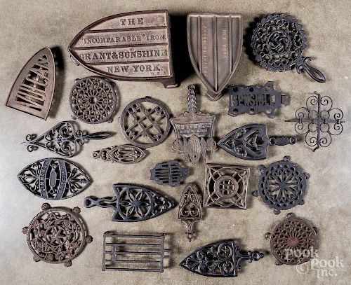 Thirty-six cast iron trivets, 19th c.