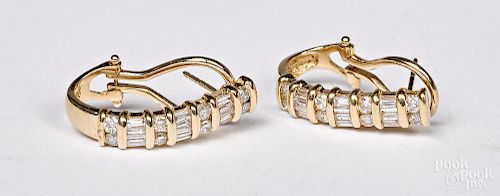 Pair of 14K yellow gold and diamond earrings