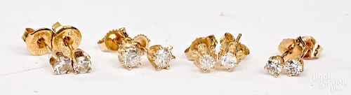 Seven pairs of 14K gold diamond stud earrings