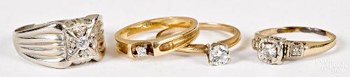 Four 14K gold and diamond rings