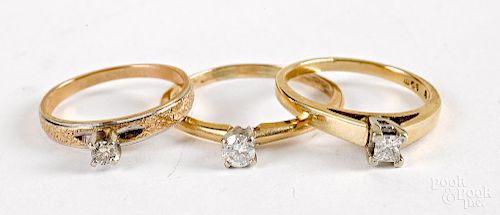 Three 14K gold diamond solitaire rings