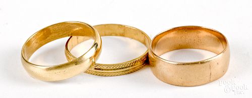 Three 18K gold wedding bands