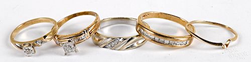 Eleven 10K gold and diamond rings